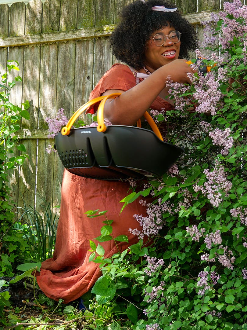 Woman foraging in her backyard