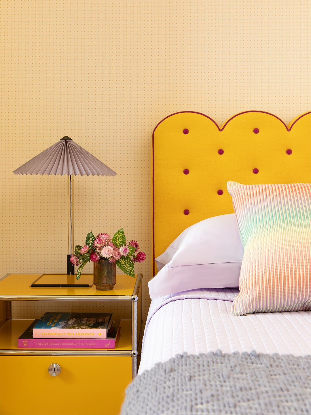 bedroom with yellow scalloped headboard