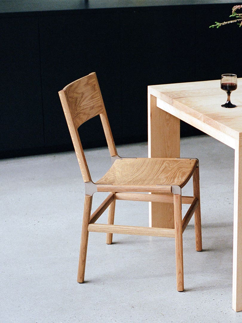 Wood dining chair at a wood table