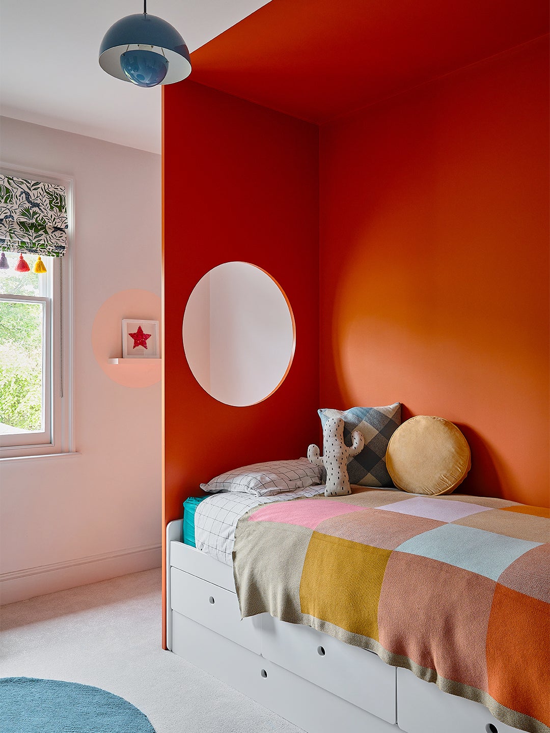 orange bed nook with circle cutout