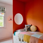 orange bed nook with circle cutout