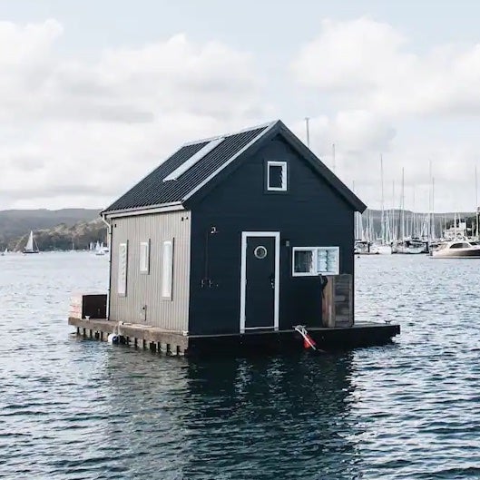 houseboat with black paneled exterior