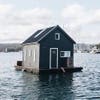 houseboat with black paneled exterior