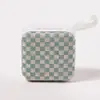 Sage green and white checkerboard mini speaker