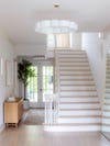 White staircase with light wood details