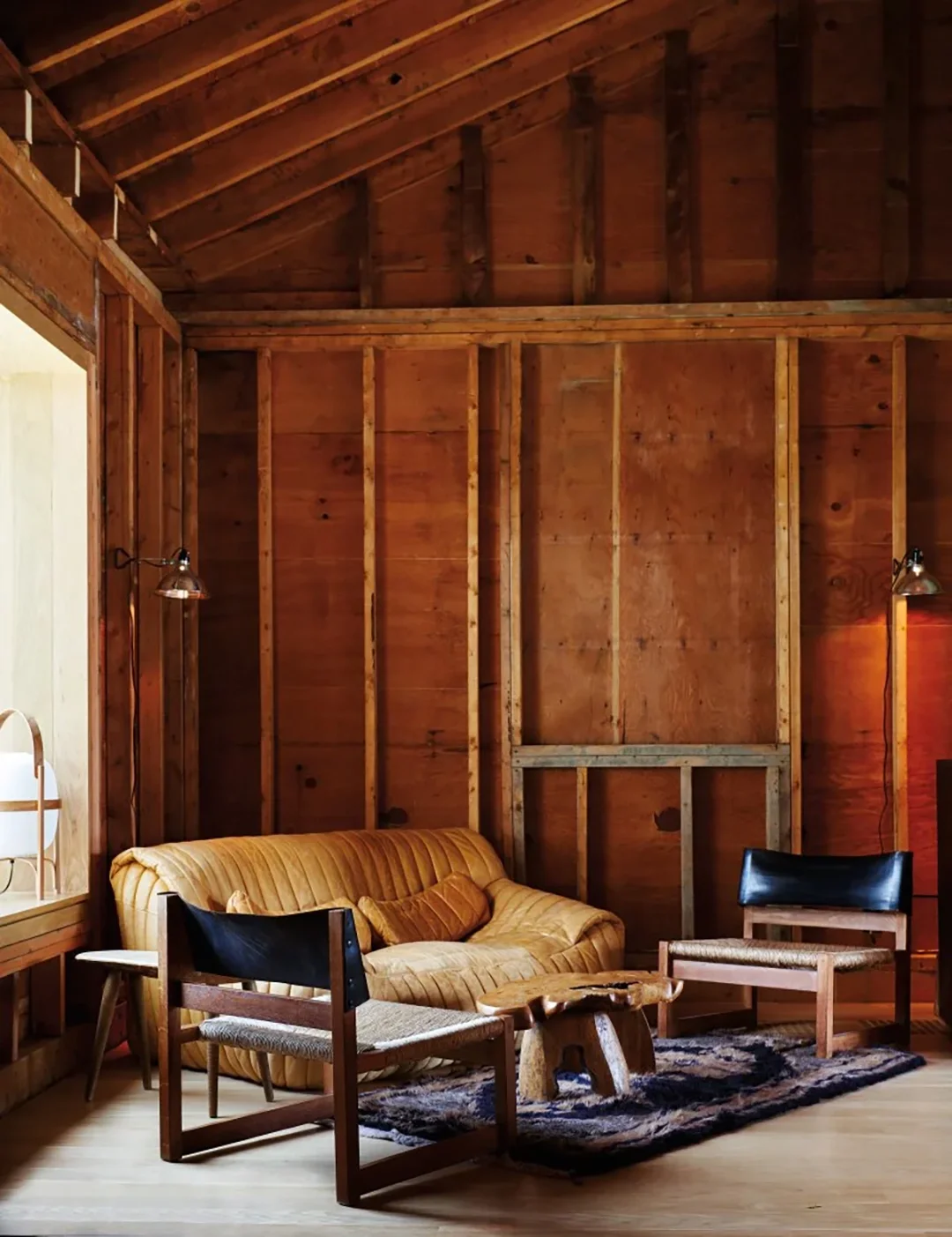 light leather sofa in corner of cabin