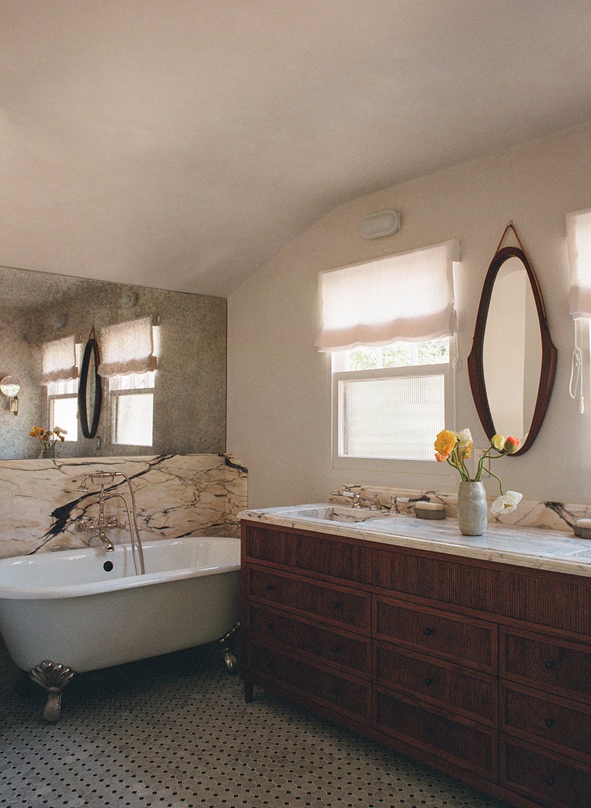 marble and mirror behind tub