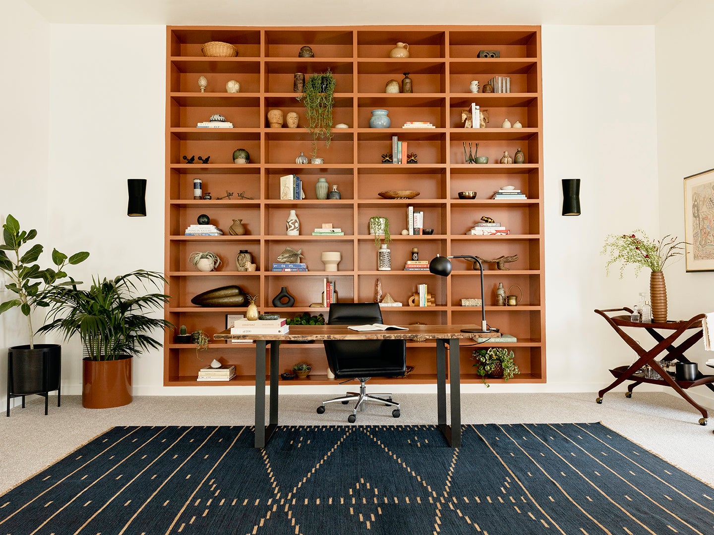 Office with desk, chair, and wood shelving
