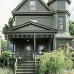 dark green victorian house