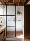 primary bathroom shower with window panes