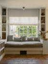 Window seat with pillows in different square shapes
