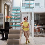 Chef Nasim Alikhani standing in front of her staircase