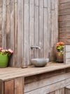 outdoor sink surrounded by wood
