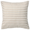 white pillow with pom poms