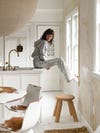woman sitting on counter