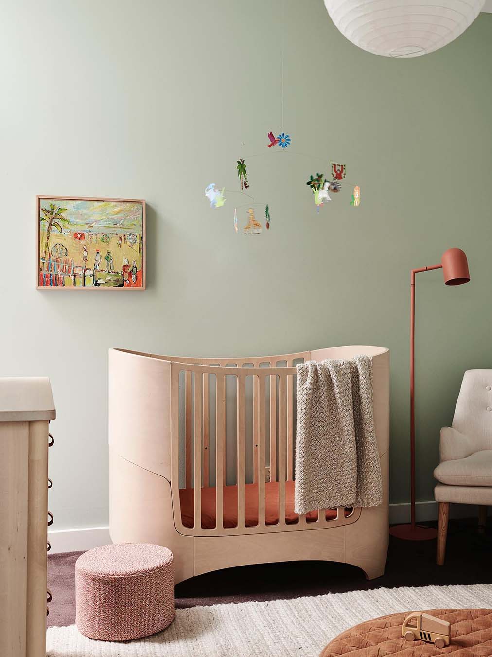 sage green nursery with terracotta accents