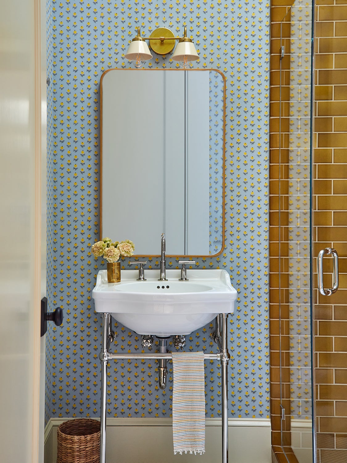 Bathroom with floral wallpaper and mustard tiles