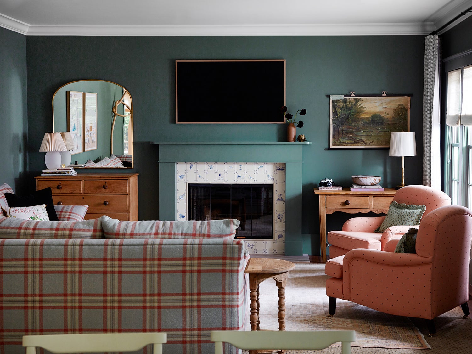 Living room with gray-green walls and plaid sofa