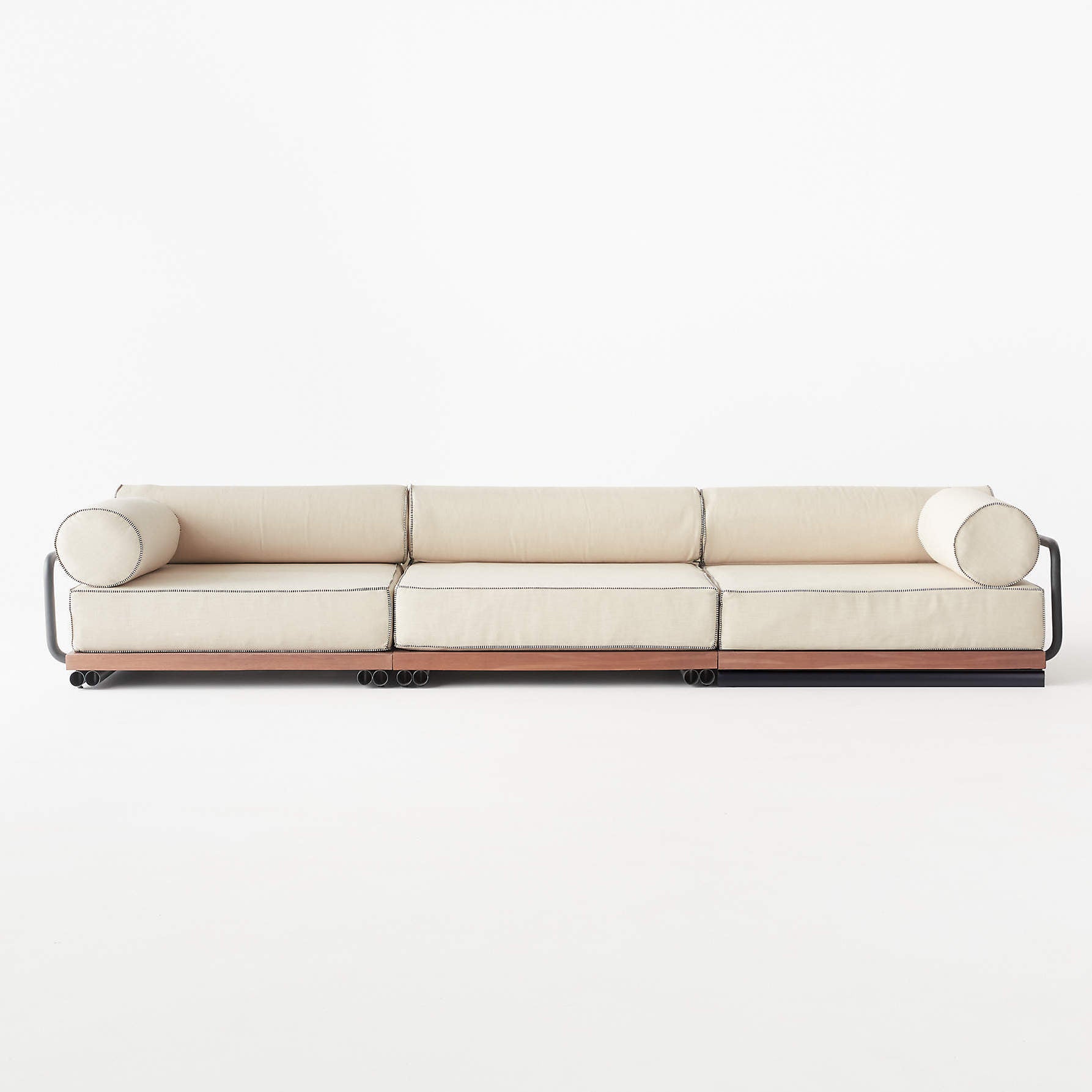 cream sofa with big bolster cushions