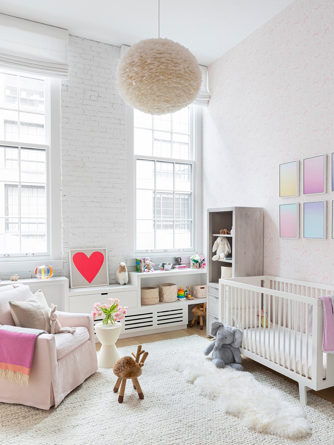 white loft nursery with pale pink wallpaper