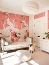 nursery with pink heron wallpaper