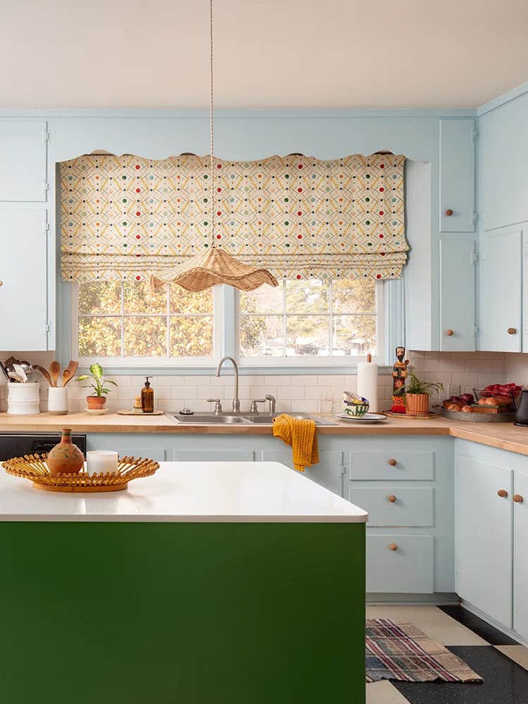 baby blue kitchen with forest green island
