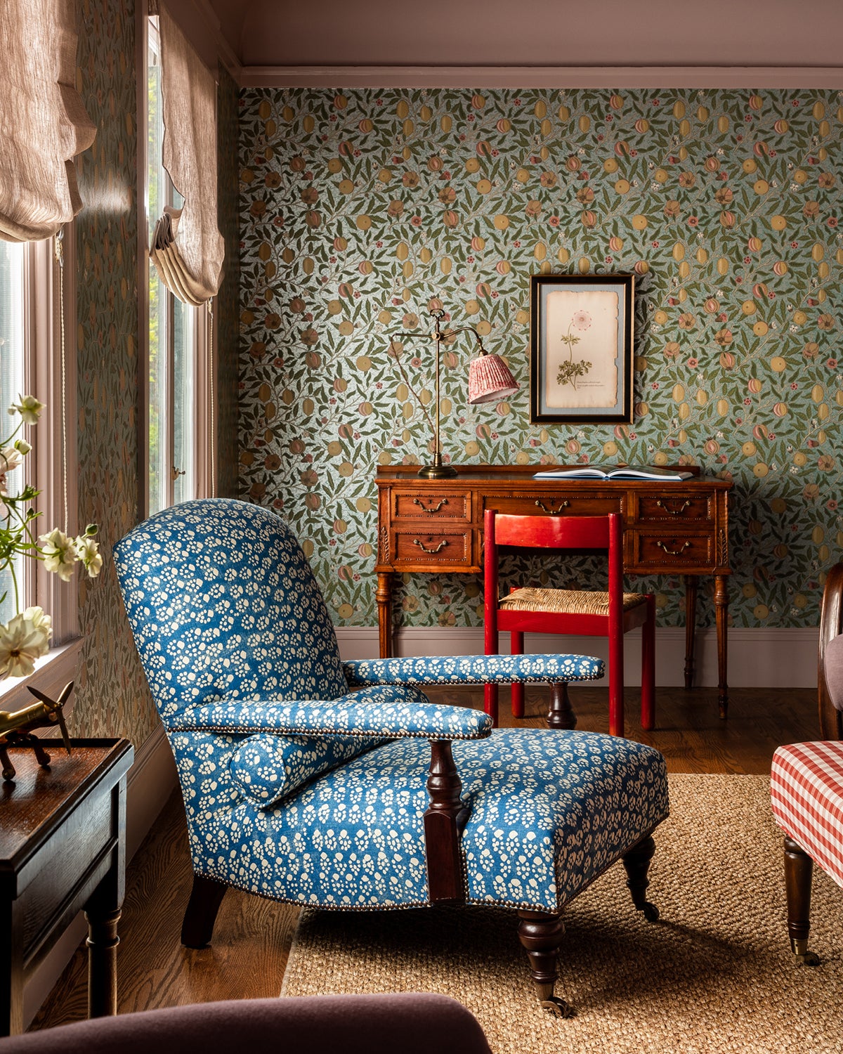 Living room with patterned chair and wallpaper