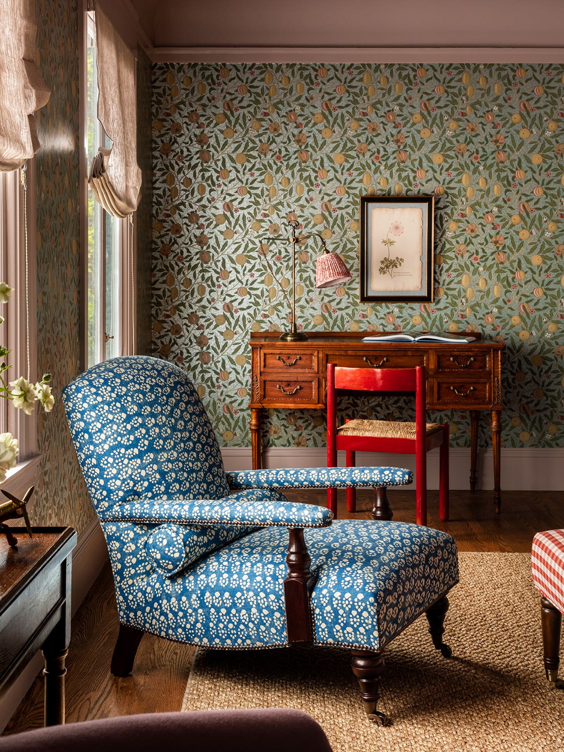 Living room with patterned chair and wallpaper