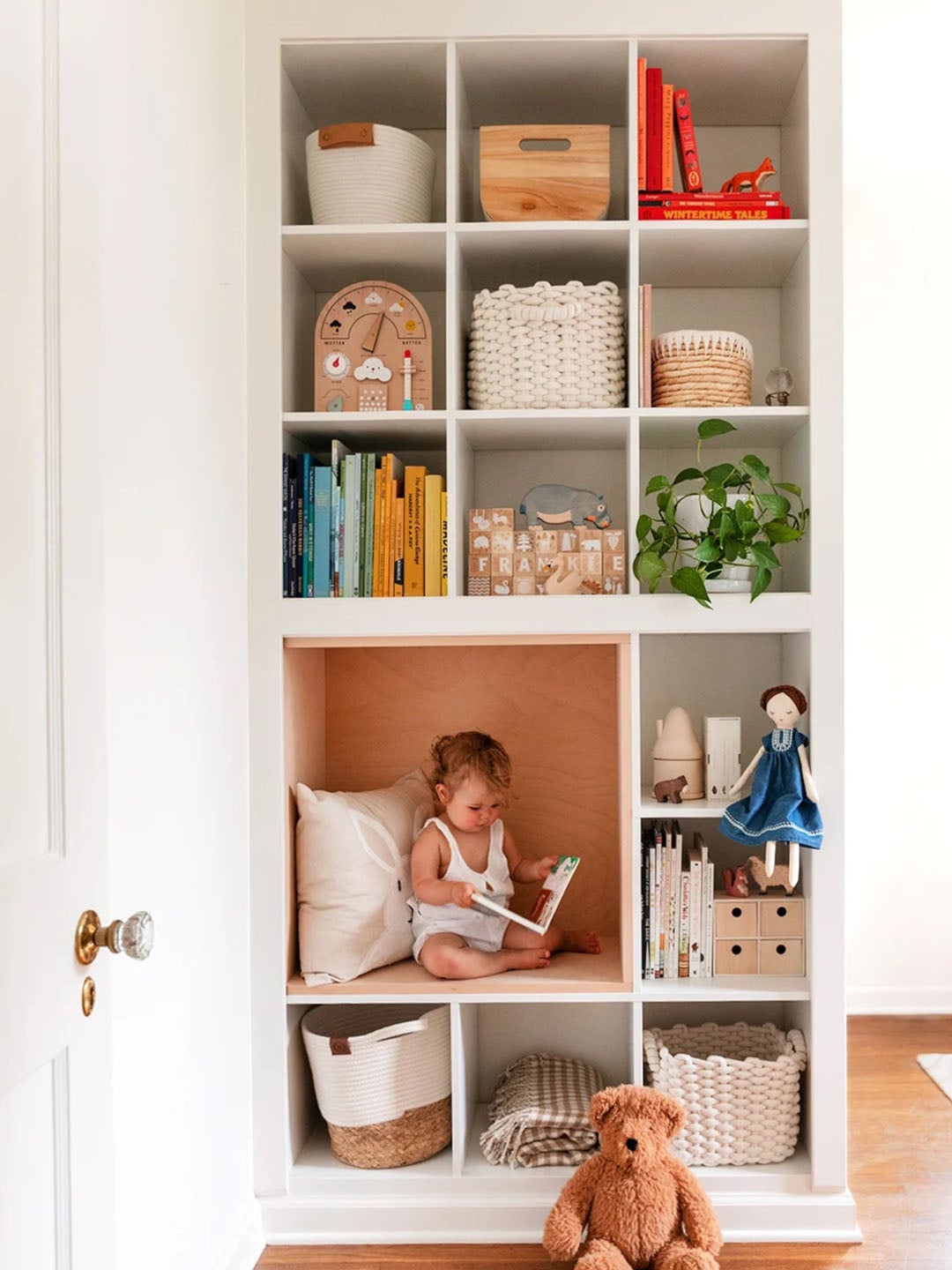 toddler in custom reading nook