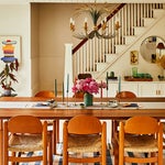 Dining table with wooden chairs and french floral chandelier