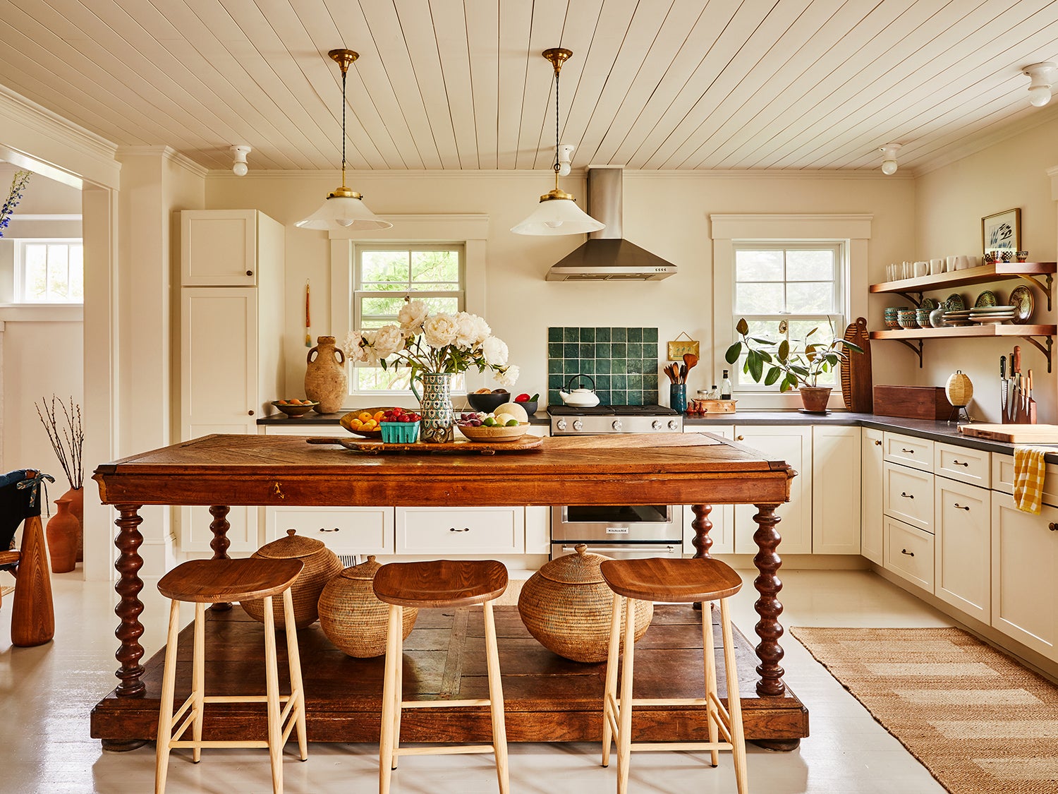 Kitchen with wooden island and wood barstools