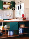 green kitchen with wood counters