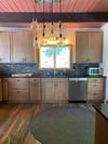 Before kitchen images with cabinets and chandelier