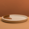 Round platter with brown shape