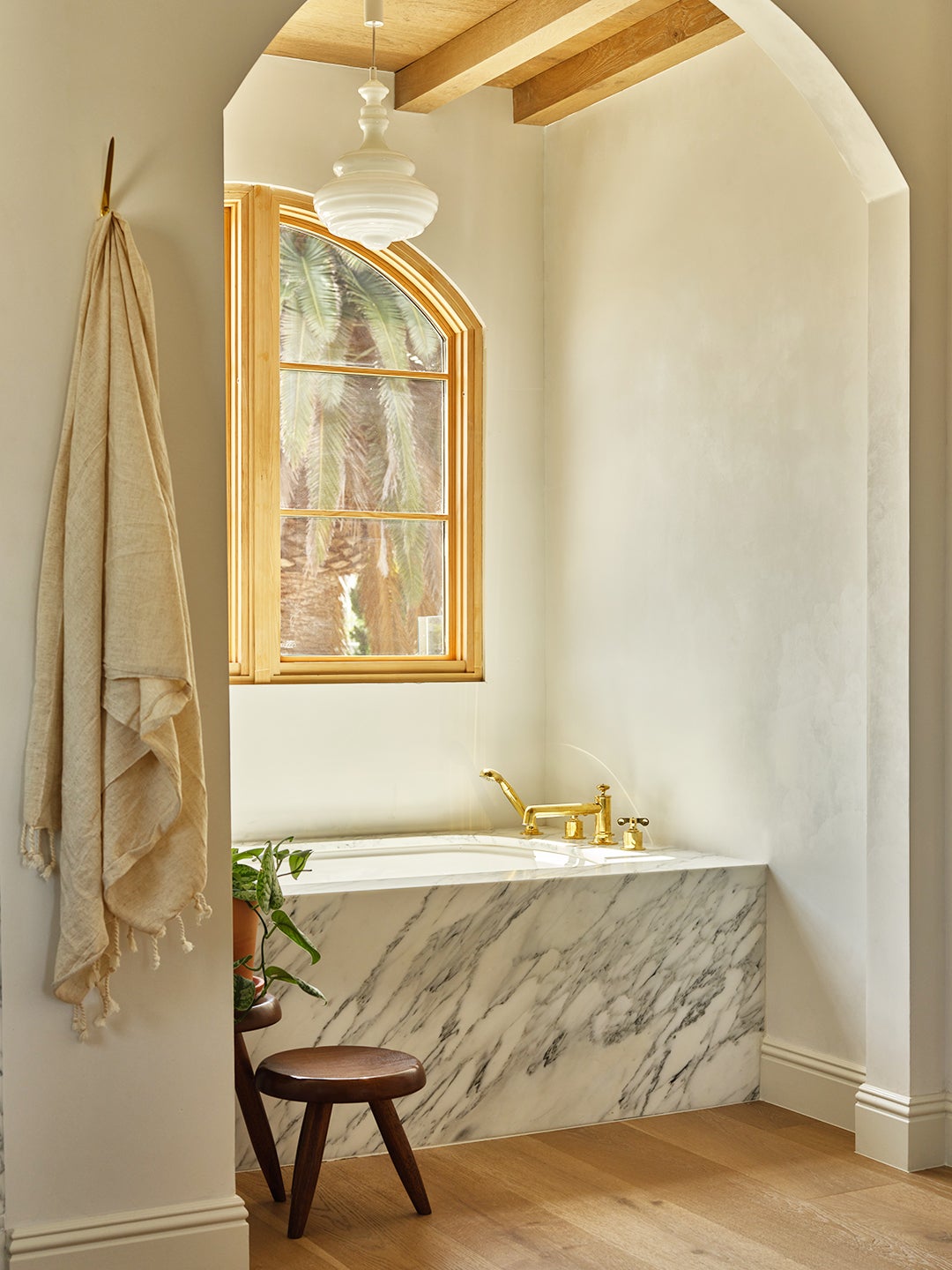 marble tub tucked under arch