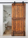 Bathroom with wooden barn door
