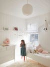 Kids' room with white walls and furniture