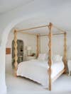 Four-poster wooden bed