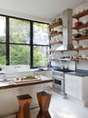 Kitchen with open shelving along wall