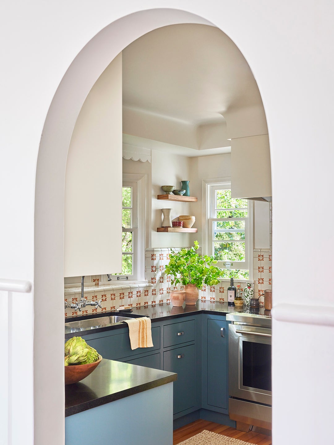 arch leading to kitchen