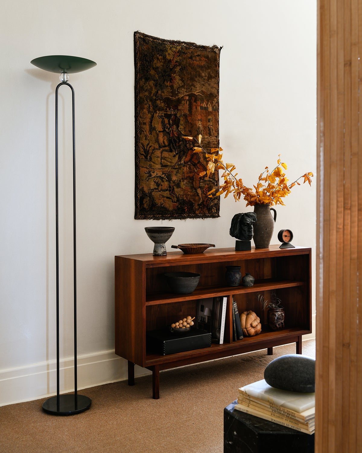 Entryway with wood console and floor lamp