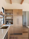 Kitchen with hidden fridge doors