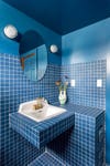 Blue tile bathroom with white grout