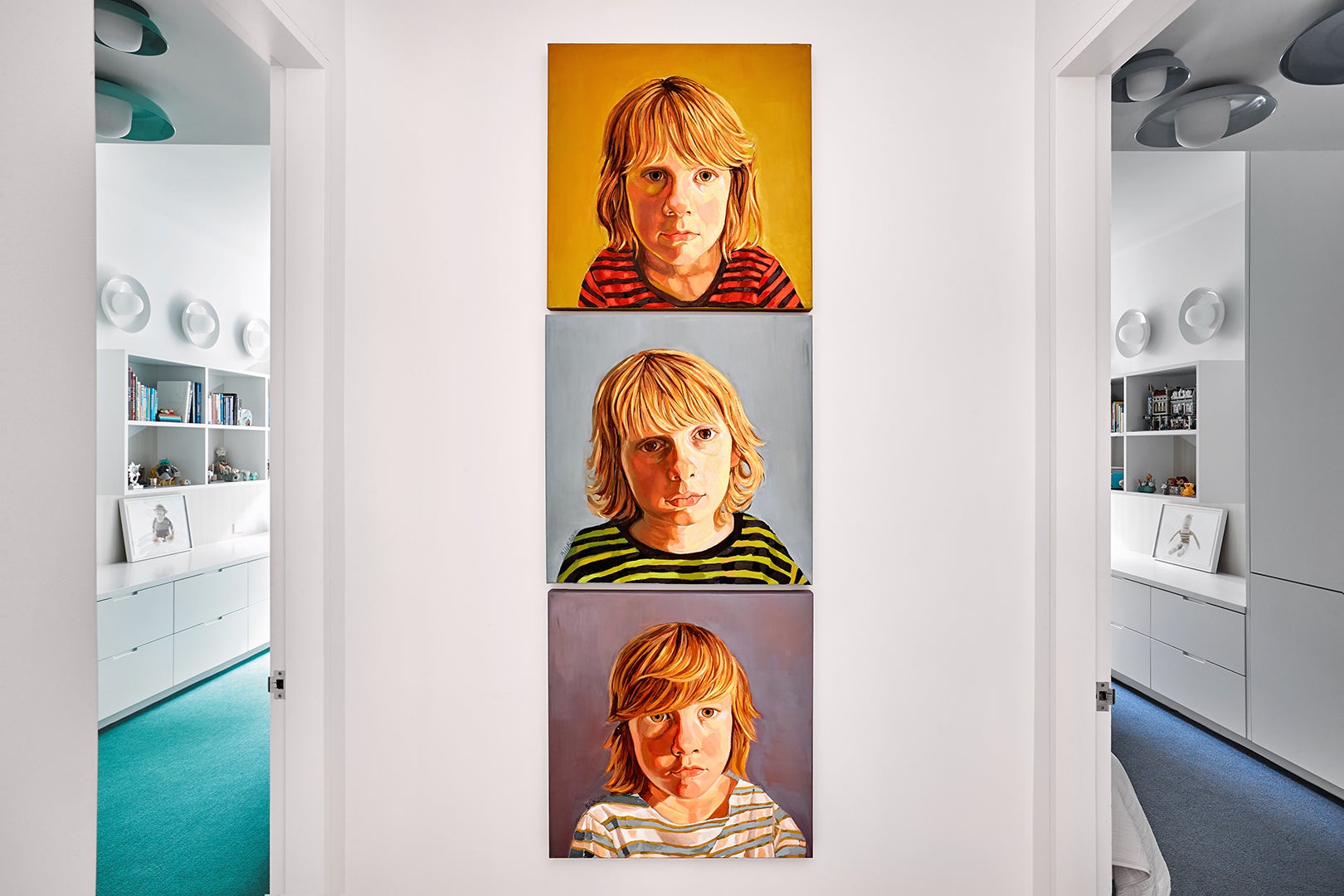 Painted portraits of three boys hanging in vestibule.
