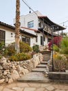 spanish style house with steps leading up to it