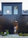 Black steel-clad home exterior.