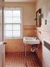 Bathroom with peach tile