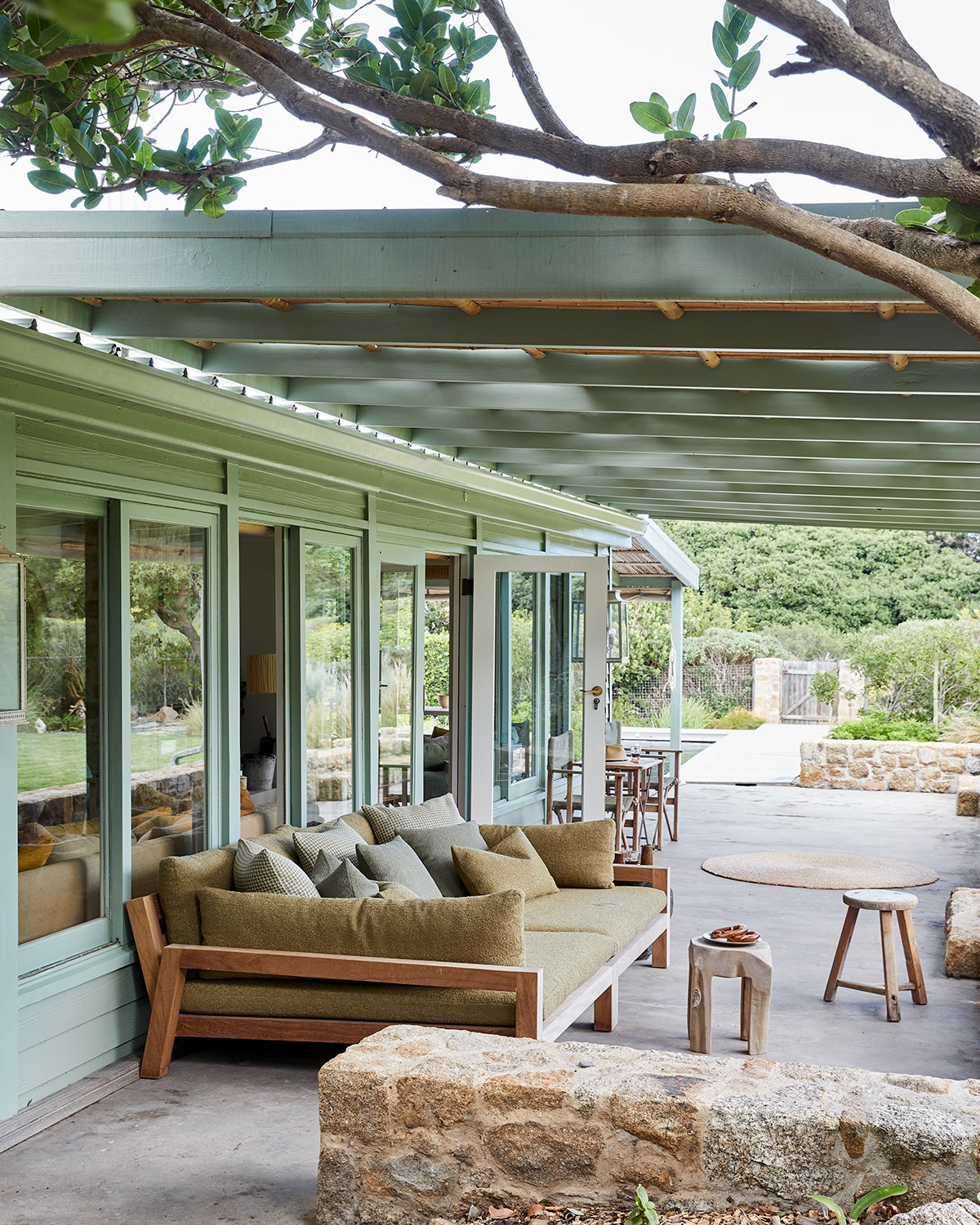 green house exterior with large outdoor sofas