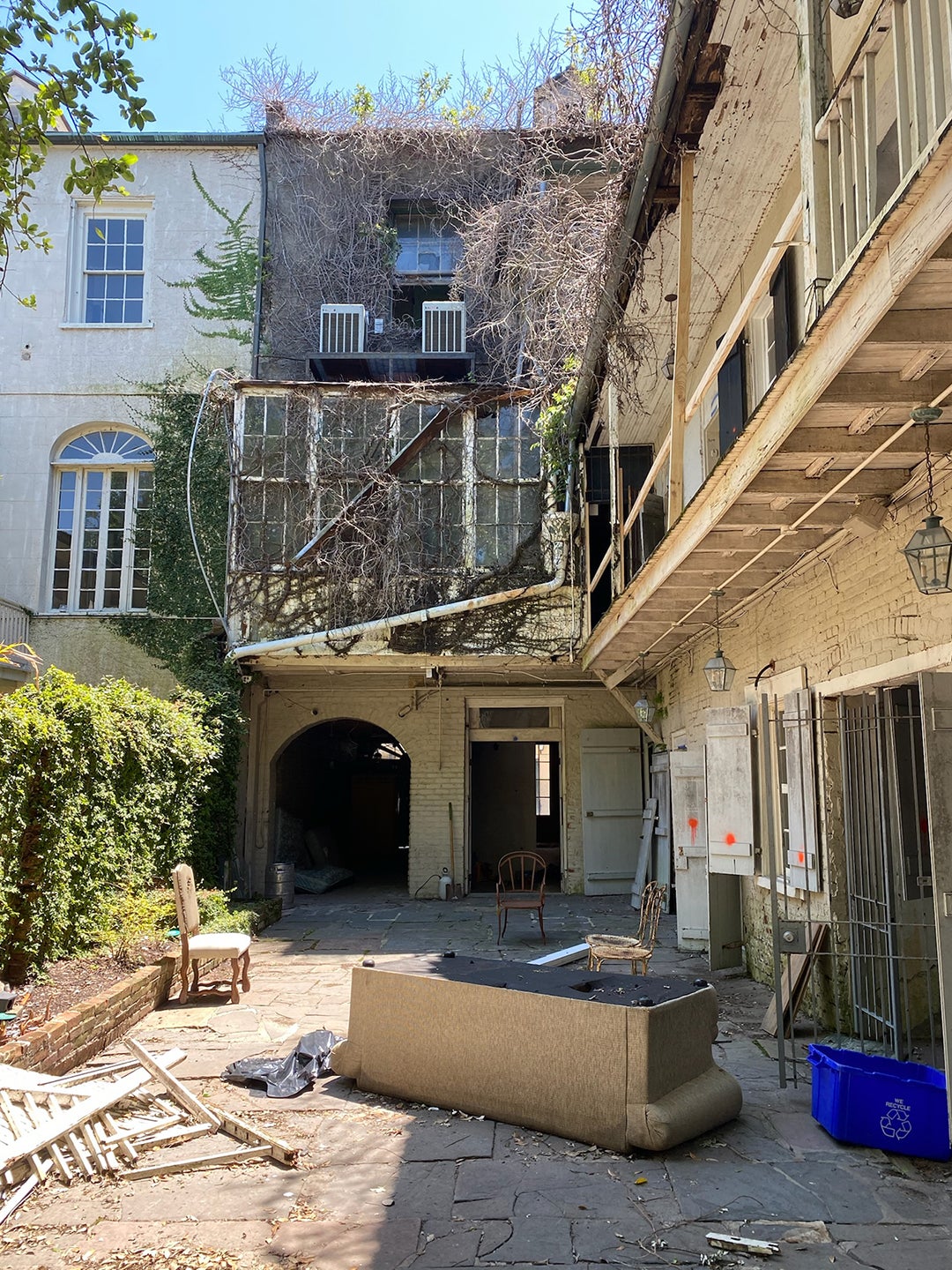 before image of rundown courtyard in new orleans