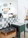 sink with checkered backsplash